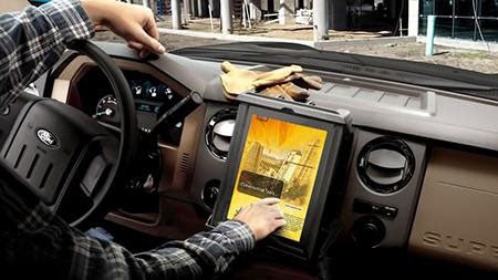 Tablet mounted to the dash of a car