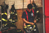 firefighter prepping gear